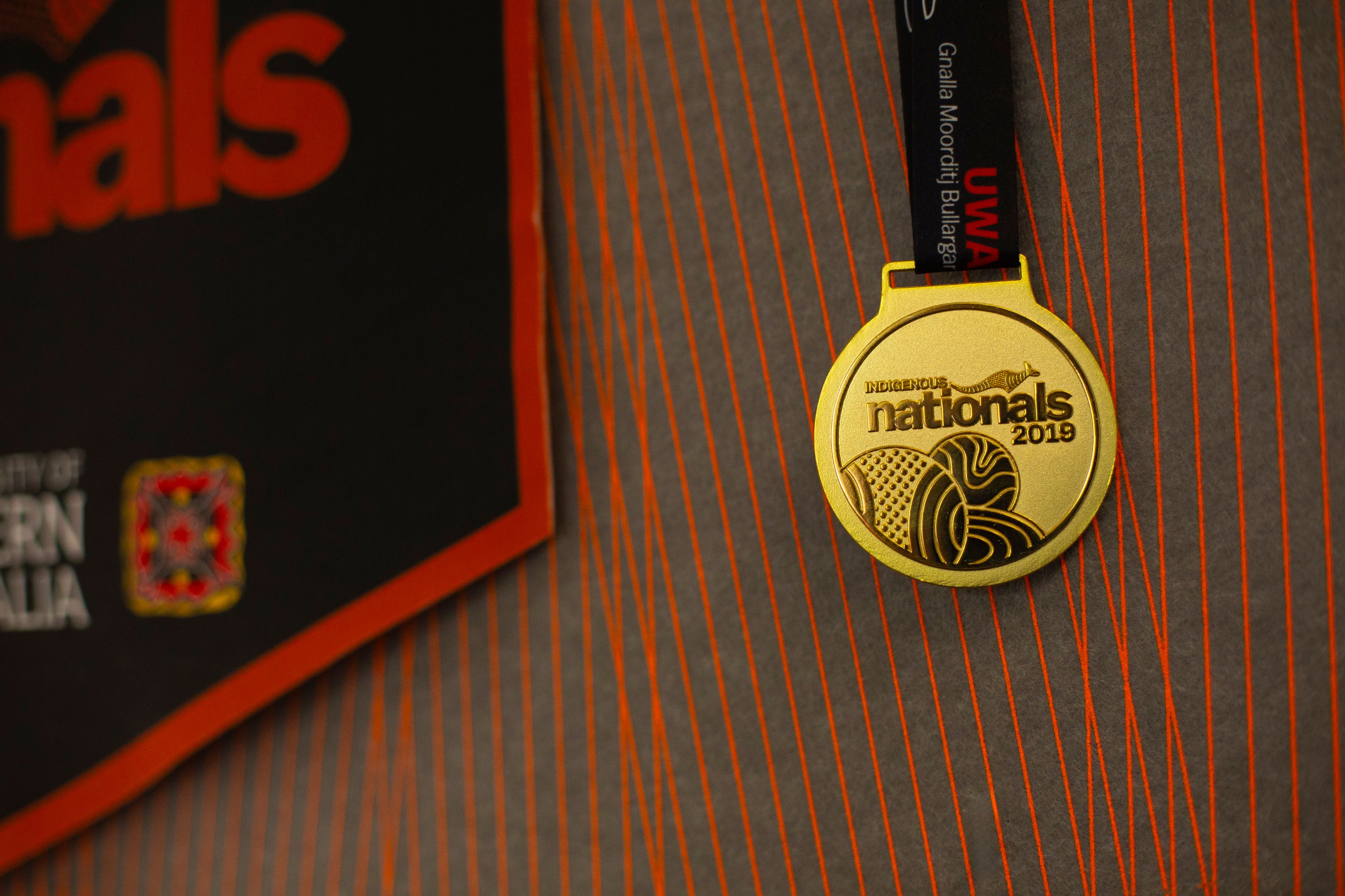 A medal in the Indigenous Student Lounge from Swinburne's participation in the UniSport Indigenous Nationals Competition. A medal in the Indigenous Student Lounge from Swinburne's participation in the UniSport Indigenous Nationals Competition.
