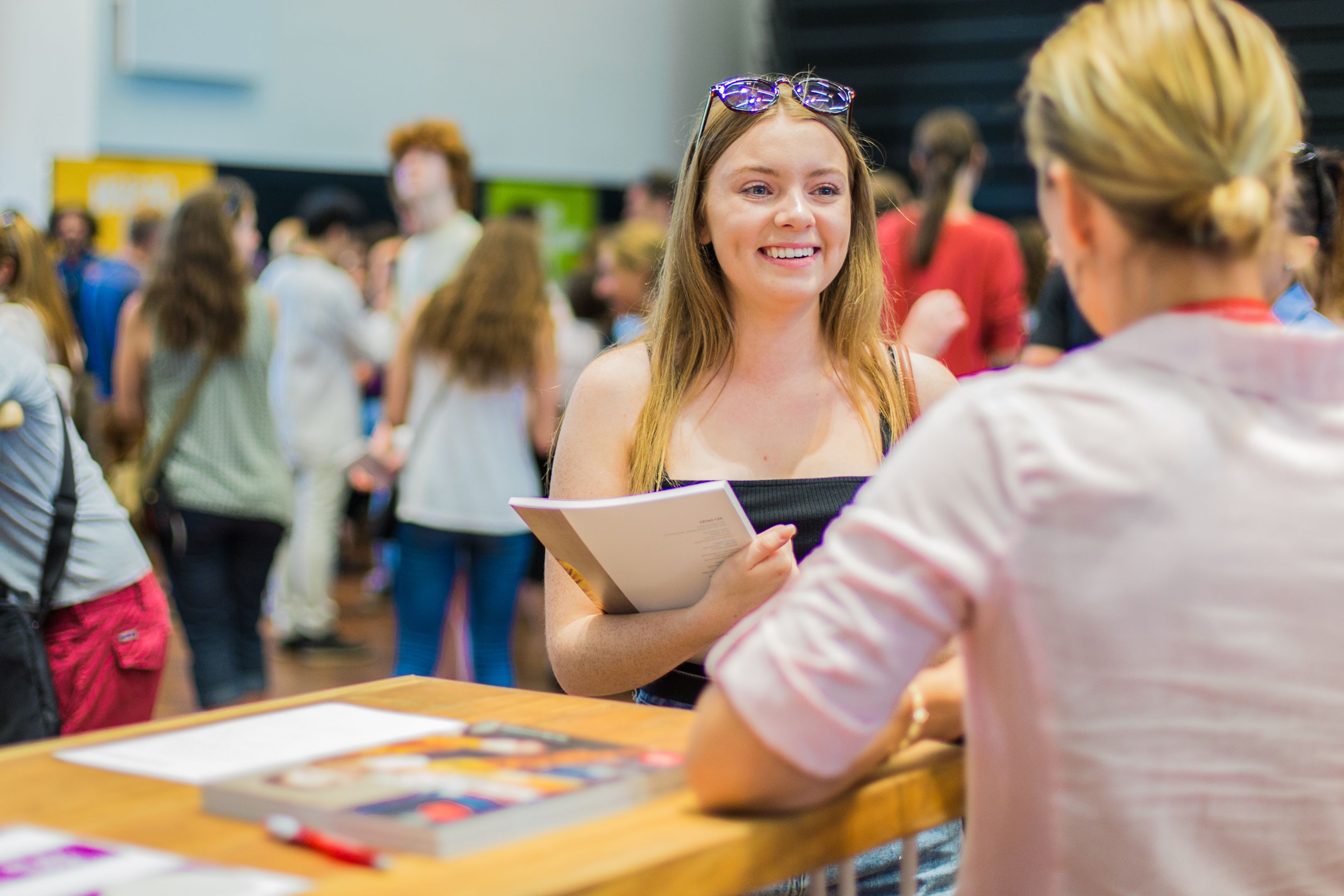 Students at JIE Evening Female student discusses her university pathway with a Swinburne agent