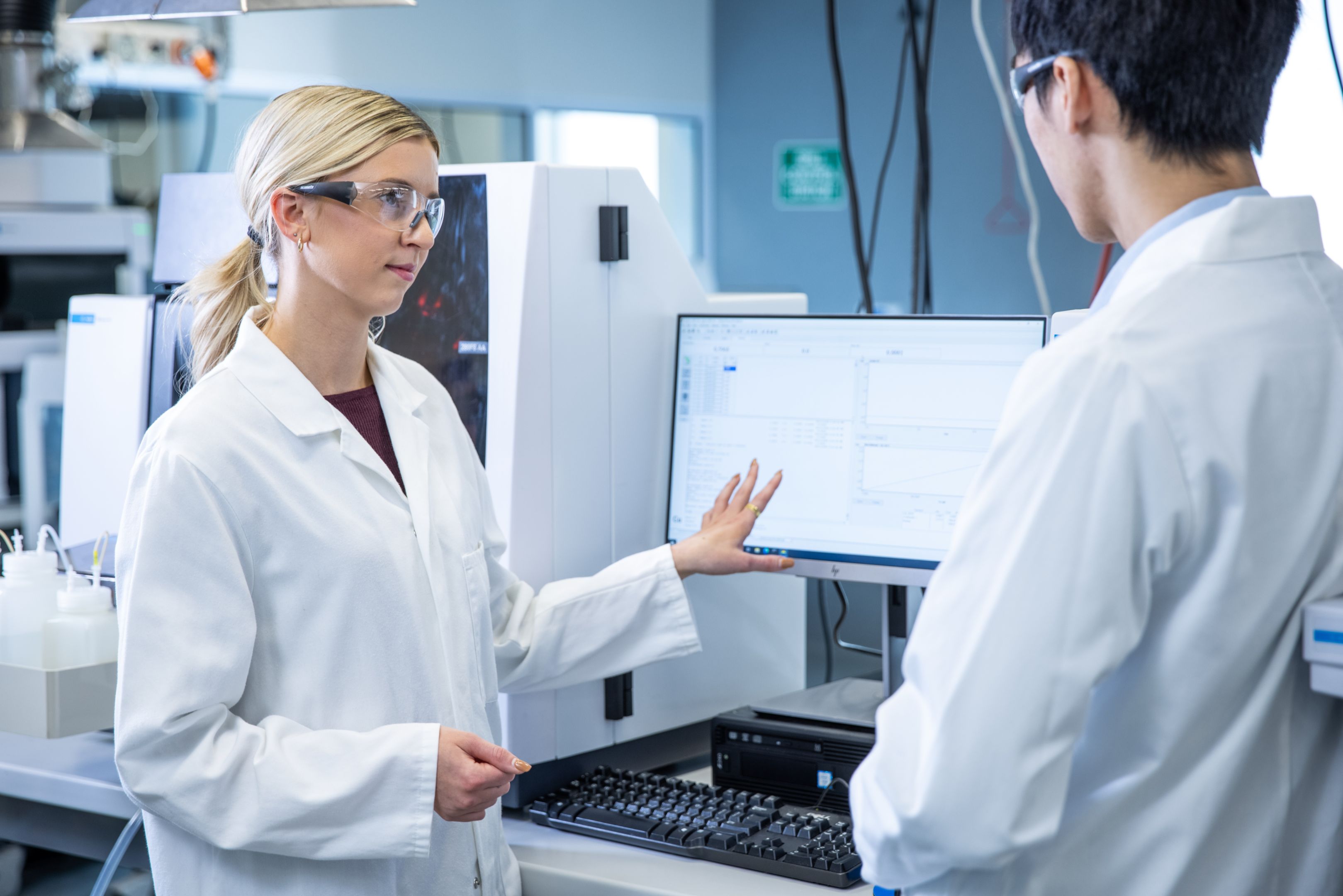 Two students working at Agilent technologies