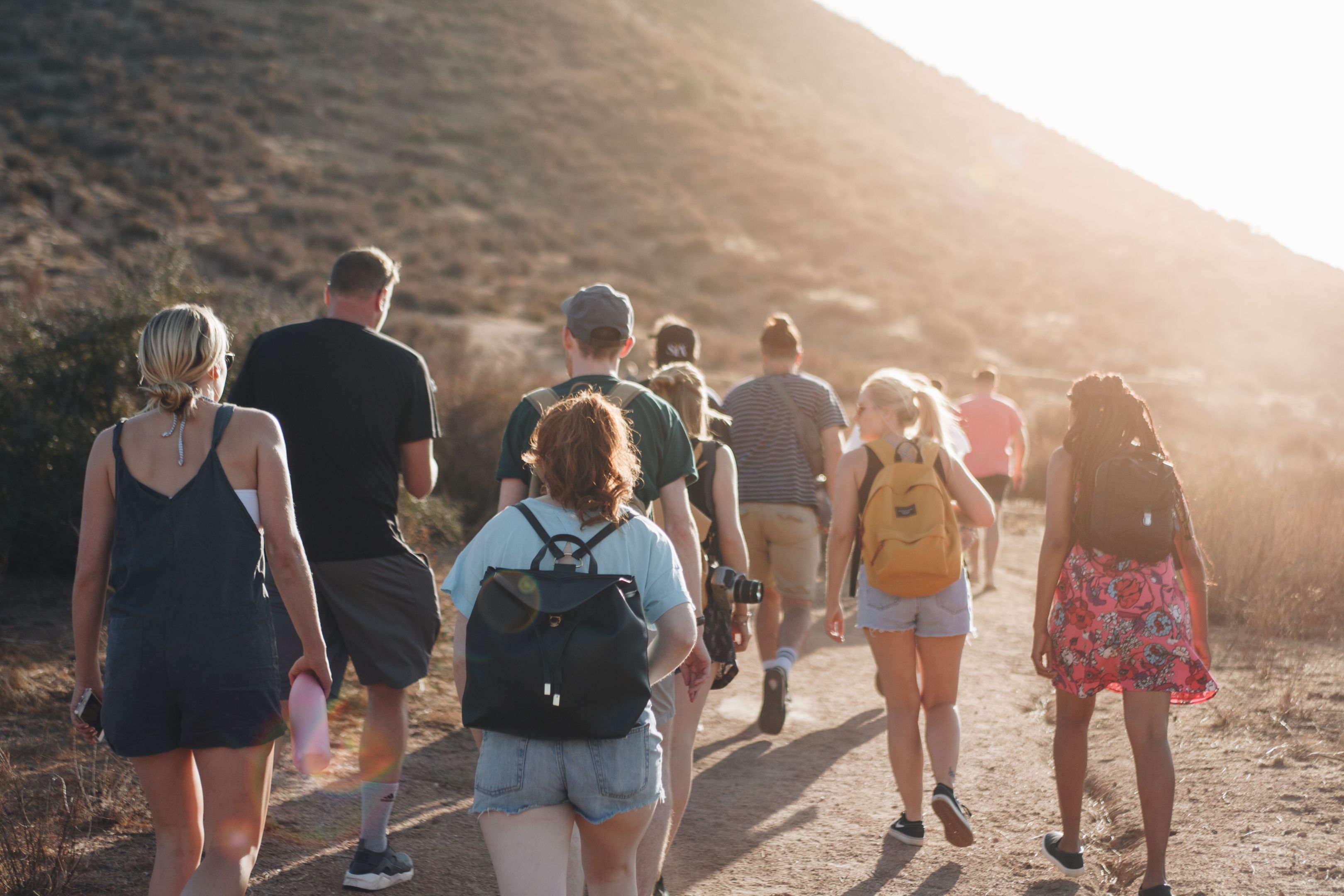 People trekking through a mountain People trekking through a mountain