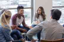 In therapy, teen boy shares life experiences with group