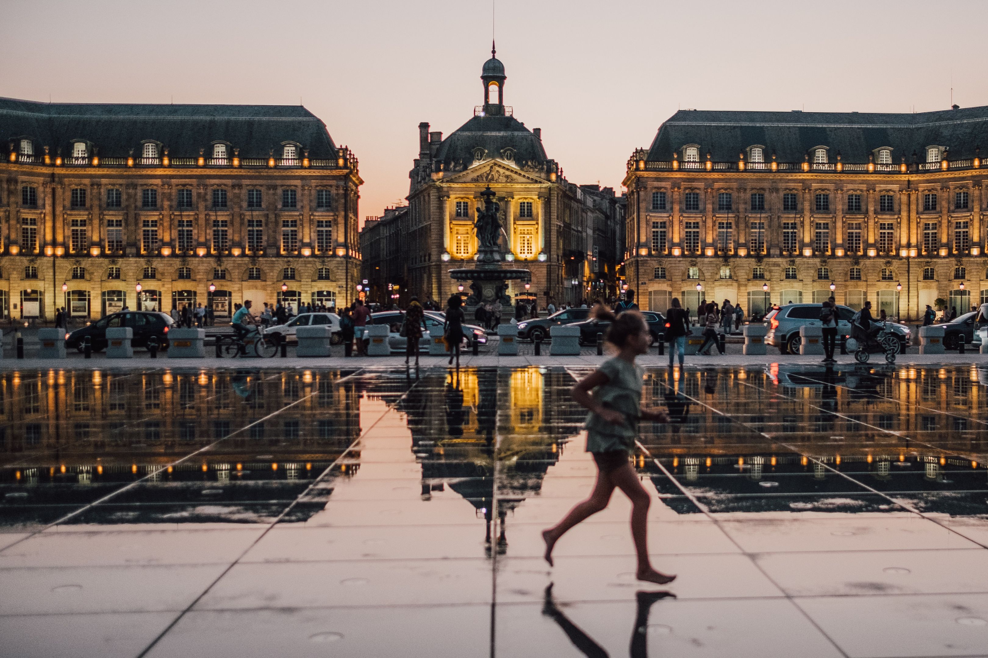Image of the city of Bordeaux in France Image of lit up buildings in the city of Bordeaux in France. It is night time and the floor is showing a beautiful mirror image of the buildings.