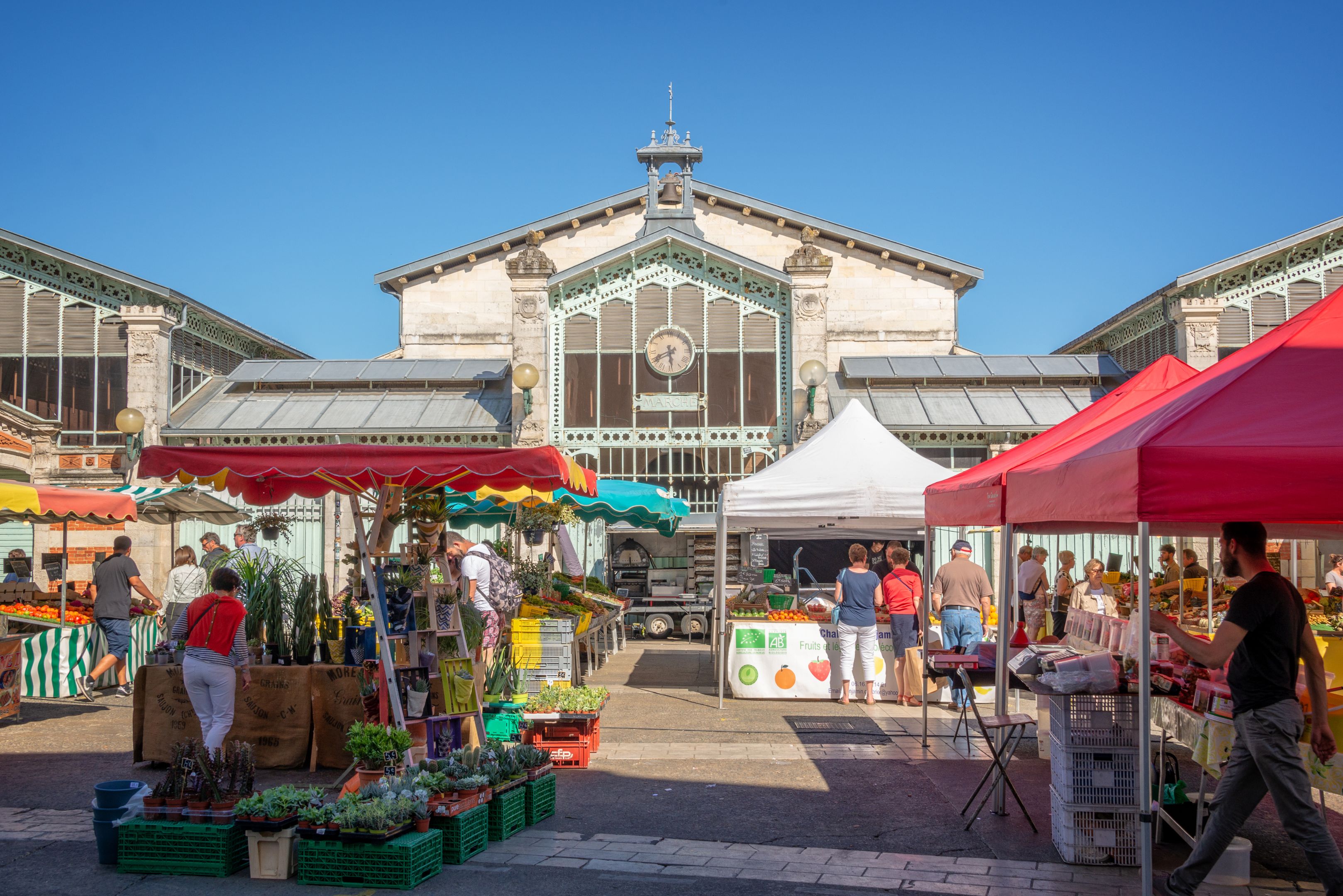Market square in the old town of La Rochelle, France People shopping in summer on the market square in the old town of La Rochelle, France