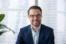 Professional businessman dressed in a smart suit.