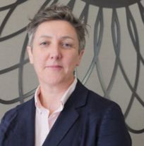 Nicola Carr Headshot of Professor Nicola Carr wearing pink shirt and navy blazer