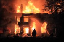 silhouette on housefire background