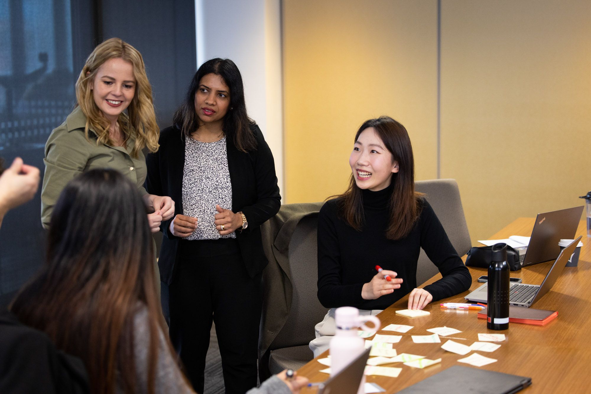 four-women-discussing.jpg 4 people presenting their ideas