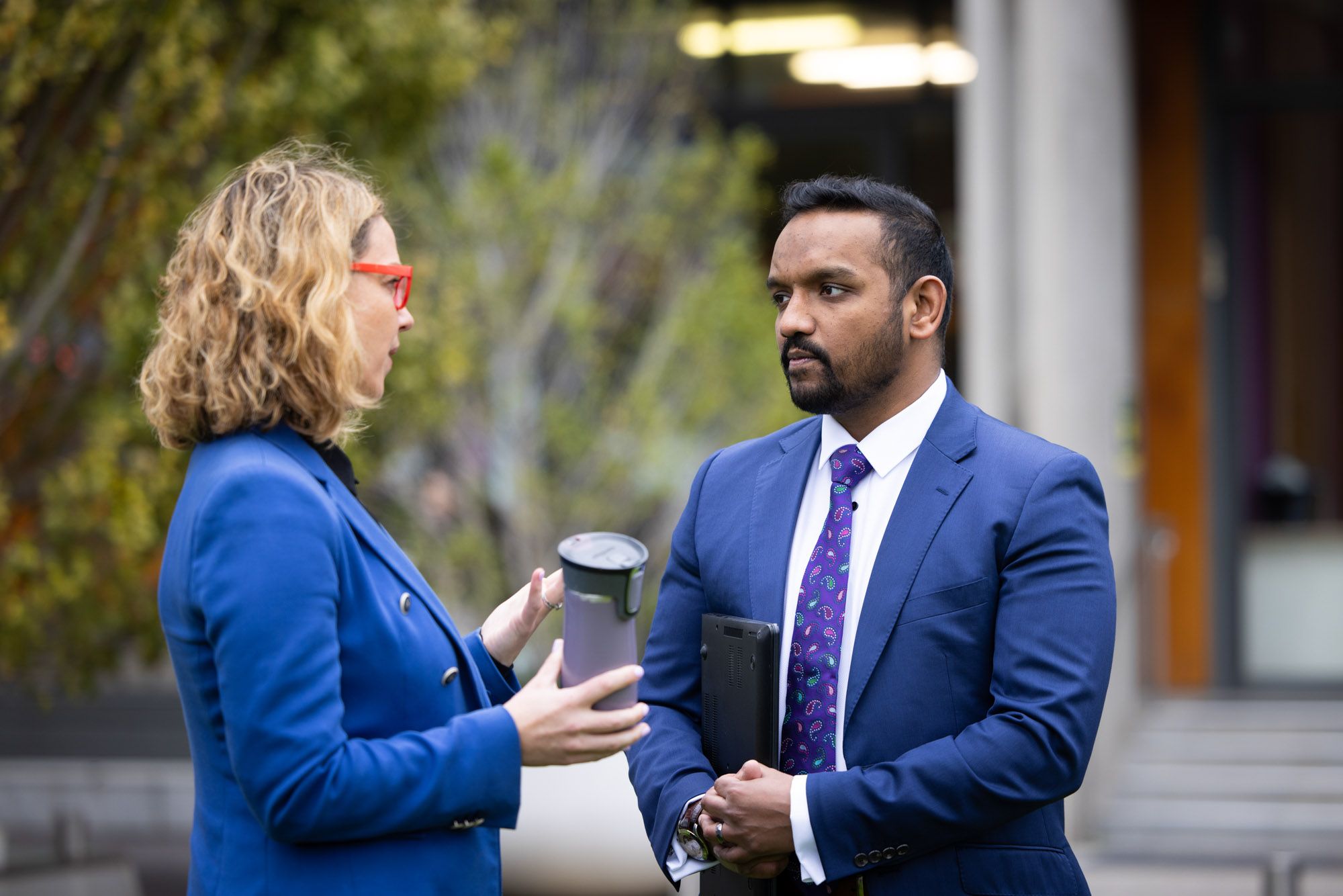 serious-conversation-between-managers.jpg A woman and man having a serious conversation