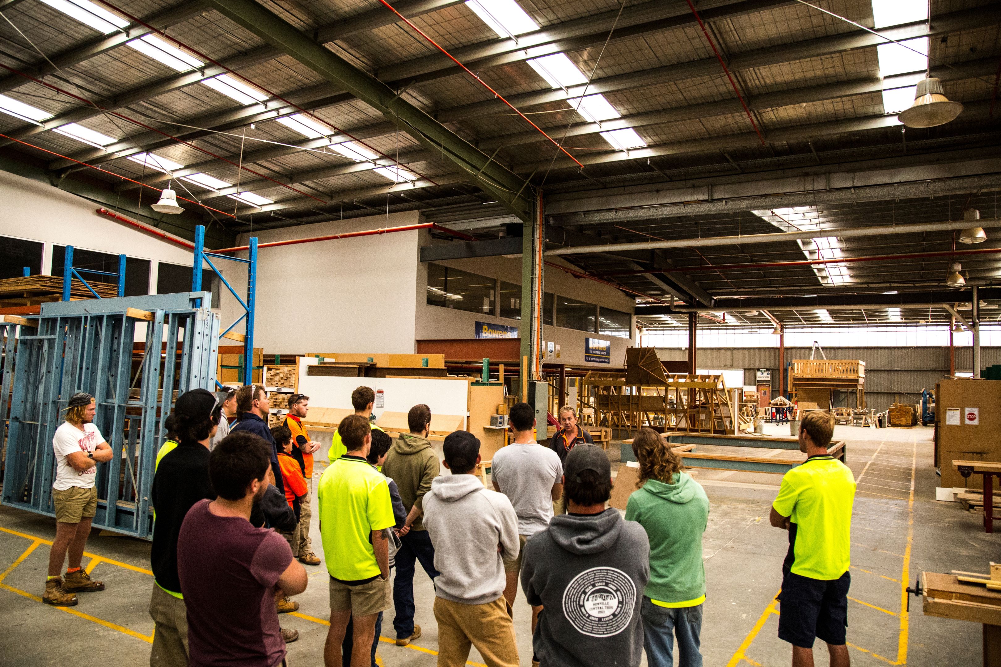 Trades at Croydon campus Group of young trade students listening to teacher in huge indoor room