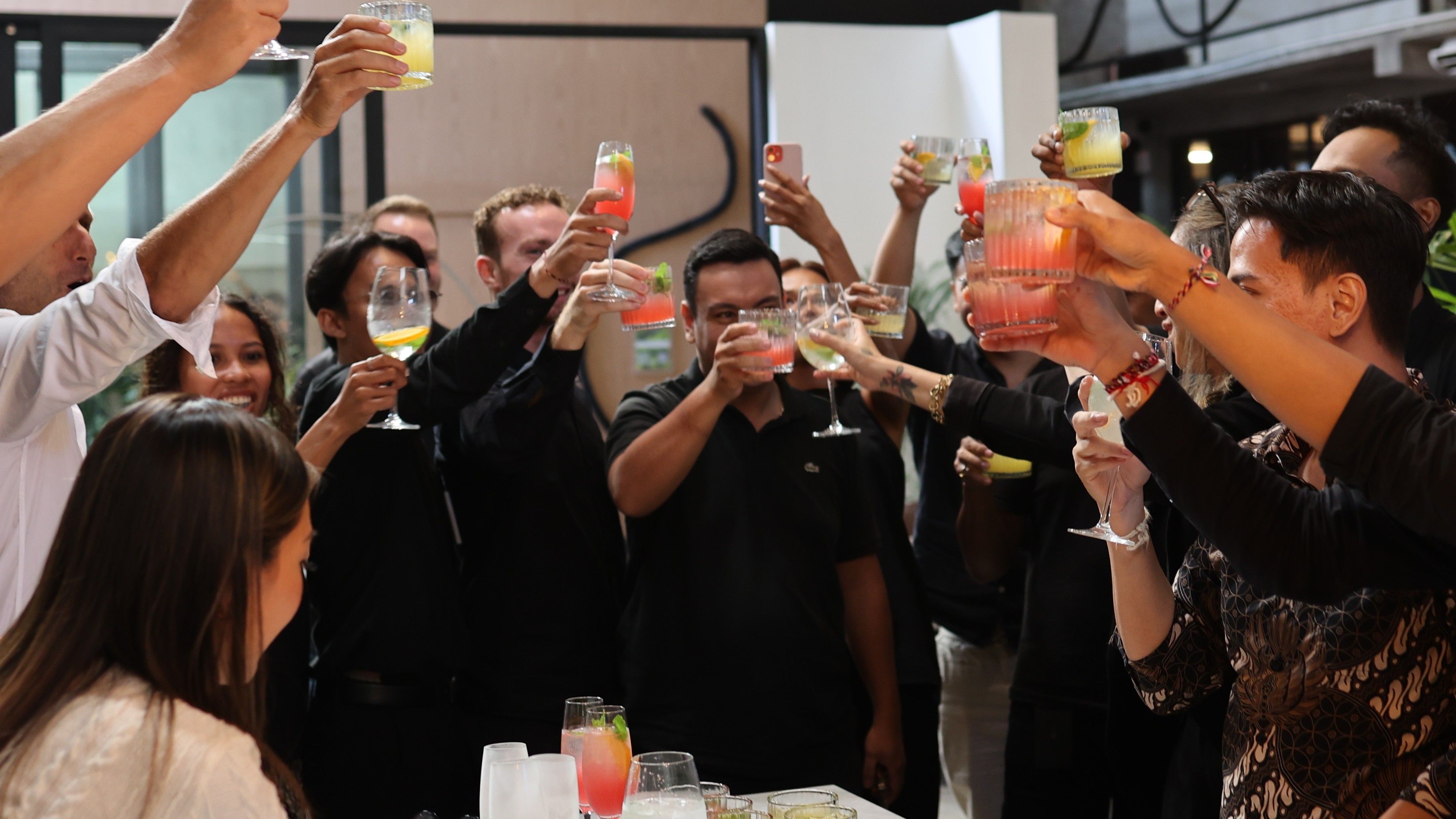 2024 NCP scholar Mitch Guest at OXO Living's grand launch Group of people holding up drinks in a cheers fashion