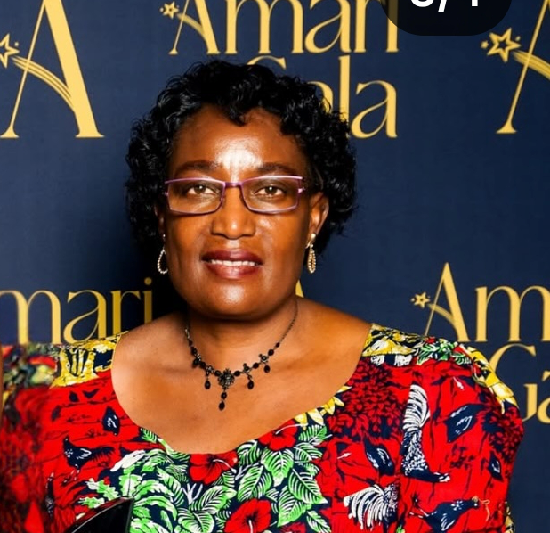 Woman in red outfit wearing glasses
