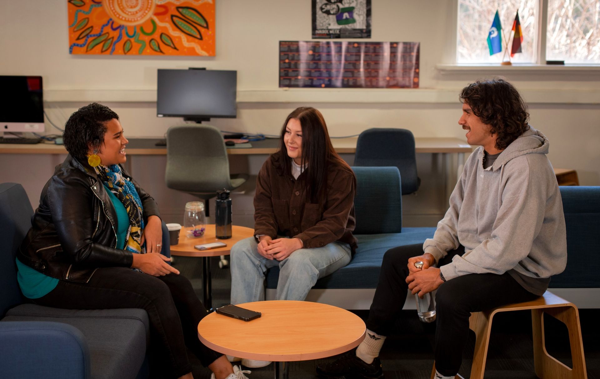 Three students having a conversation in the Indigenous Student Lounge. Three students having a conversation in the Indigenous Student Lounge.