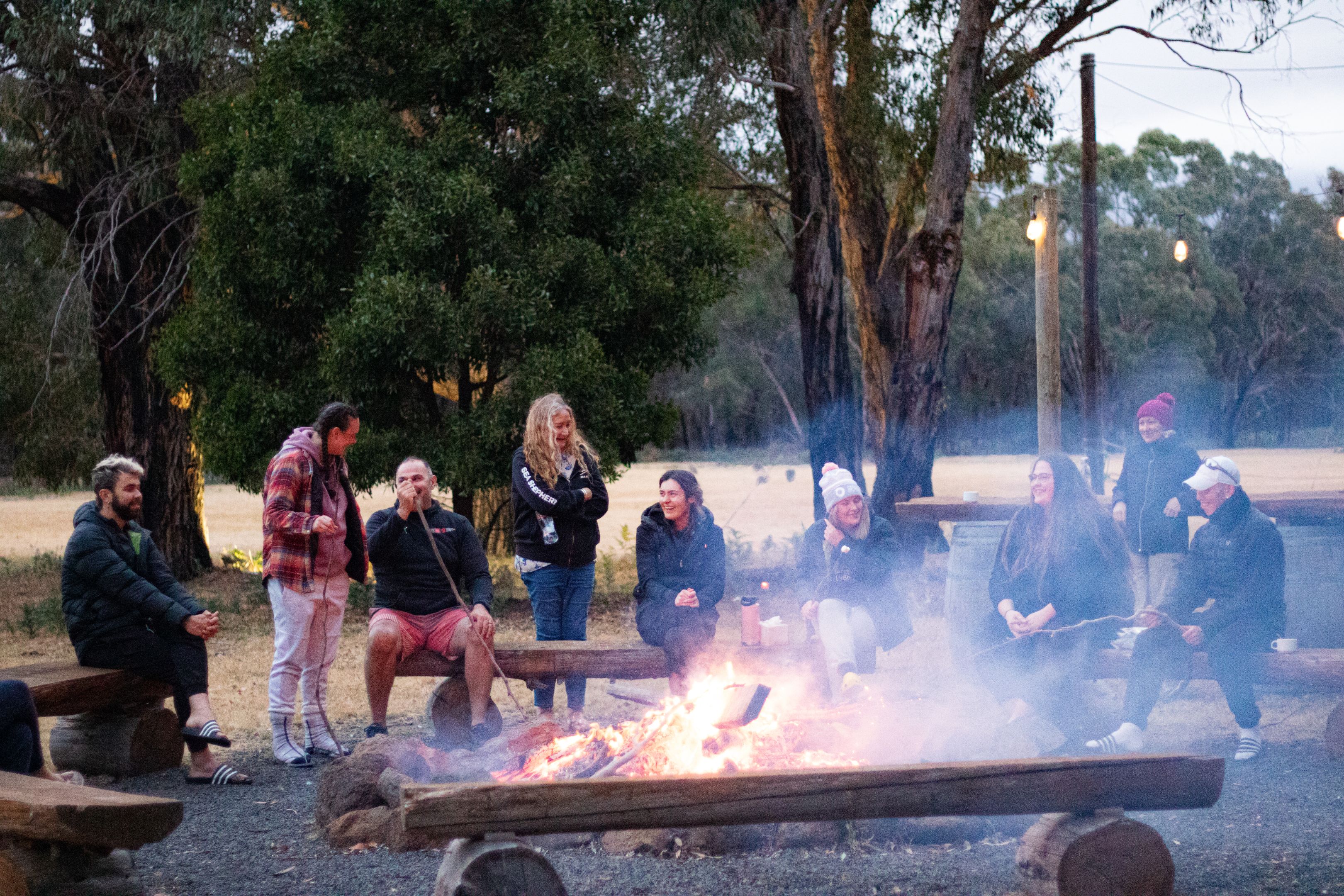 Indigenous students and MTC staff members around a bonfire during the MTC On-Country Development Program. Indigenous students and MTC staff members around a bonfire during the MTC On-Country Development Program.