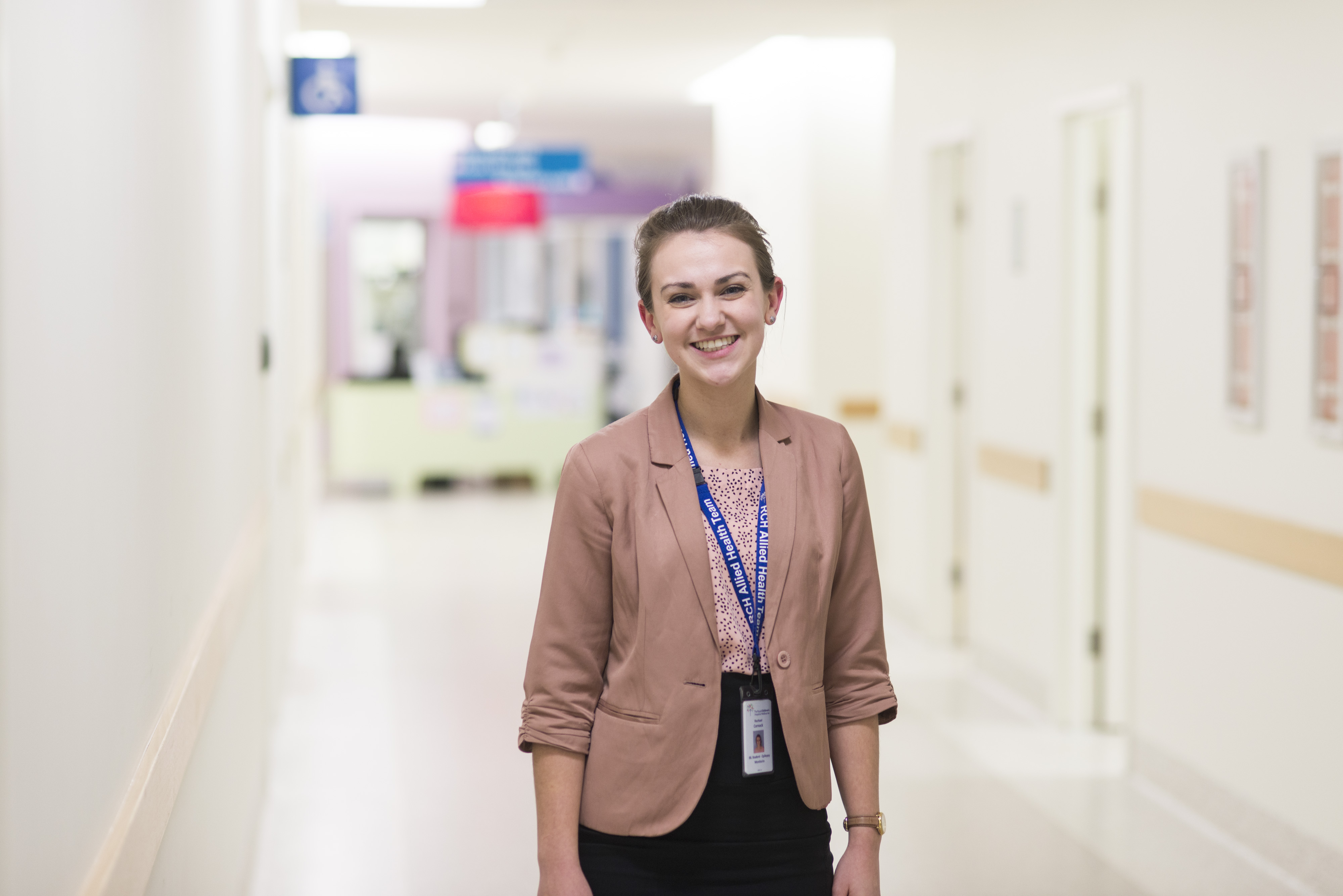 Student on professional placement A Swinburne student on placement standing in a hospital hallway.