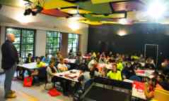 Trades students listening to their tutor in a classroom at the Croydon campus