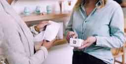 Female buying an item at a store using eftpos