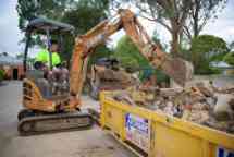 student driving a small construction vehicle